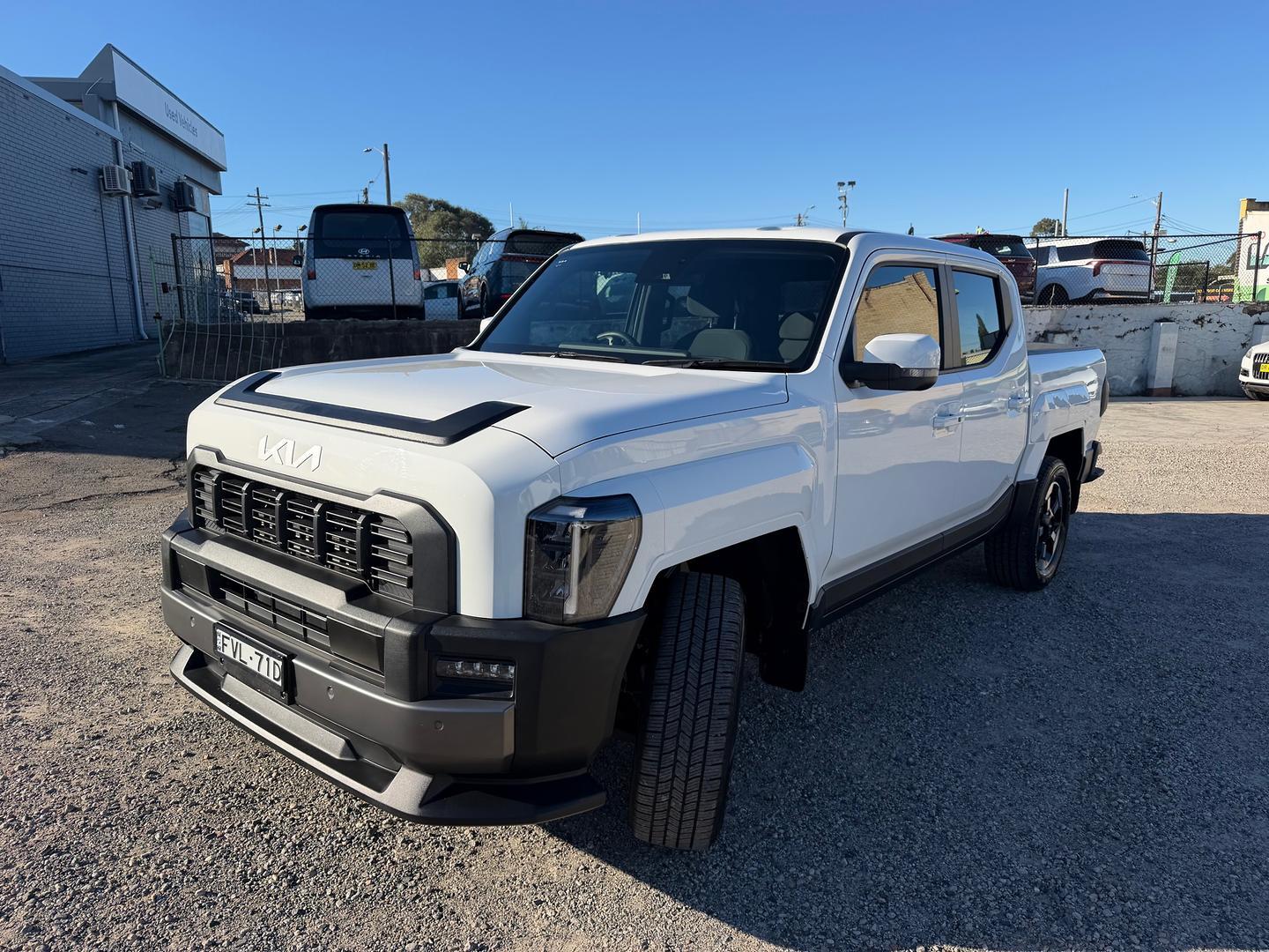 2025 Kia Tasman SX+ in Clear White (Ud)