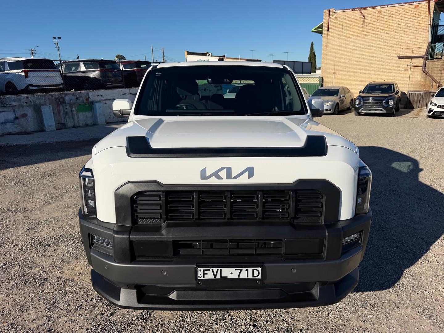 2025 Kia Tasman SX+ in Clear White (Ud)